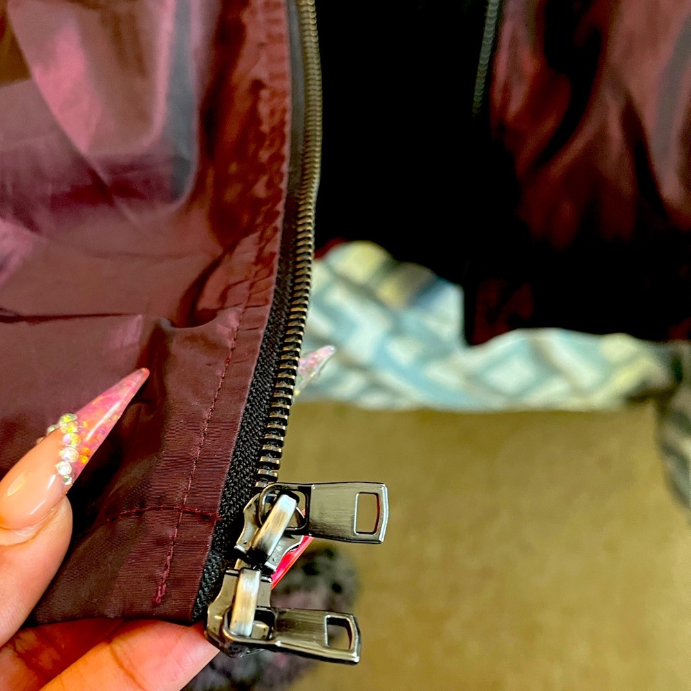 This is a L Men jacket with a Crome red reflective look to it. Bought from NYC.